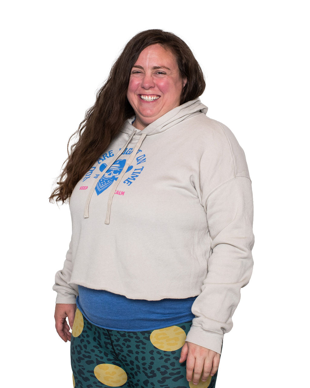 Person wearing a light gray hoodie with a graphic design on a white background