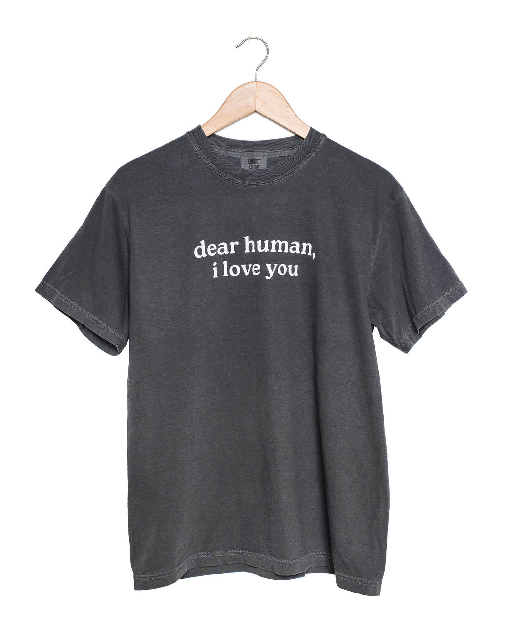 Gray t-shirt with 'dear human, i love you' text on a hanger against a white background